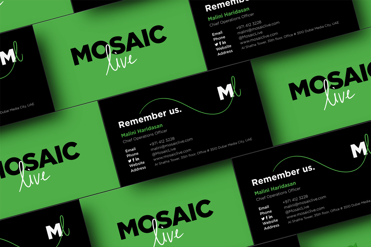 Main Mosaic Live business cards with one side green and one side black