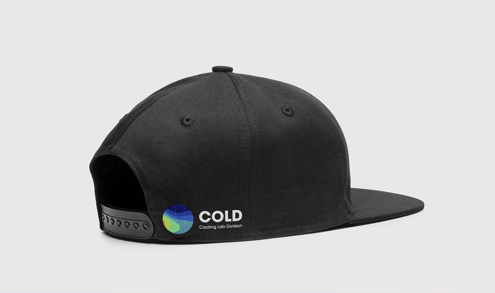 side of a cap/hat featuring COLD Cooling Lab Division a Climate-smart program branding, design by Main Division