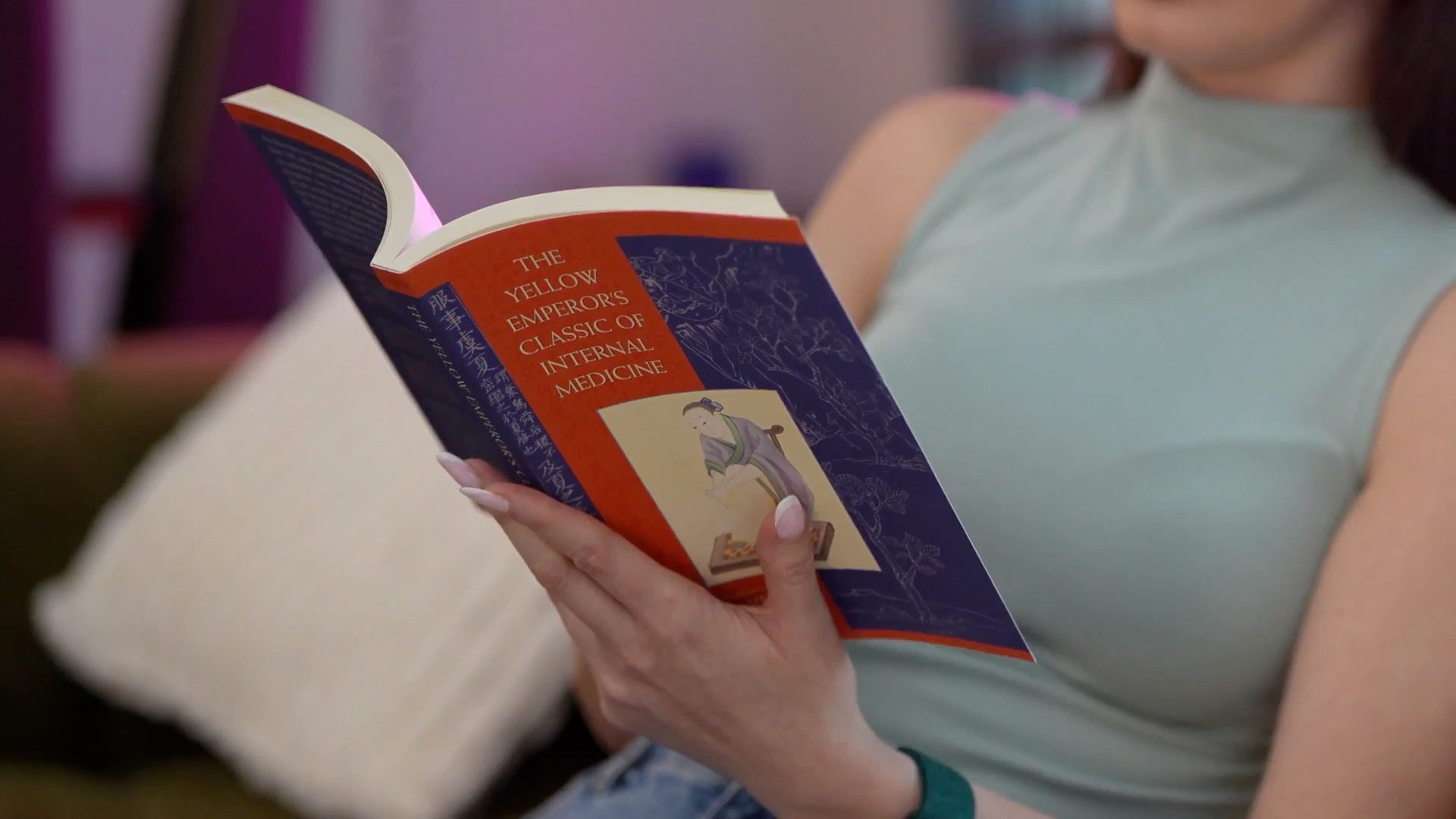 Dr Elena Seranova reading the yellow emperor's classic of internal medicine on her social media videos — content by Main Division